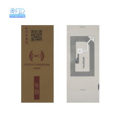 China Waterproof/Waterproof Customized Logo Coated Label HF NFC Tag Bottle Wine RFID Paper Anti-counterfeit Fragile Label for sale