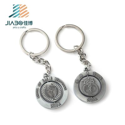 China Custom Metal Logo Rotating Engraved Metal Keychains Floating 3d Key Chain for sale