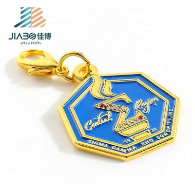 China Custom Metal Rhinestone Heptagon Key Chain Gold Mini Rhinestone Key Holder for sale