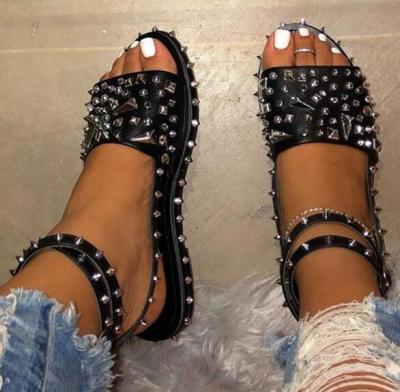 China Breathable Large Size Transparent Sandals Rivet Buckle Flat Bottom Ladies Female Sandals With Ankle Strap for sale