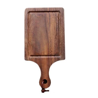 China Sustainable Wholesale Solid Wooden Bread Cutting Boards Black Wooden Steak Pizza Cutting Board for sale