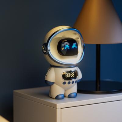 China Mini New Arrival Astronaut Design Alarm Clock BT Speaker FM Radio TF Card Smart Bedside Wake Up Table Clock for sale