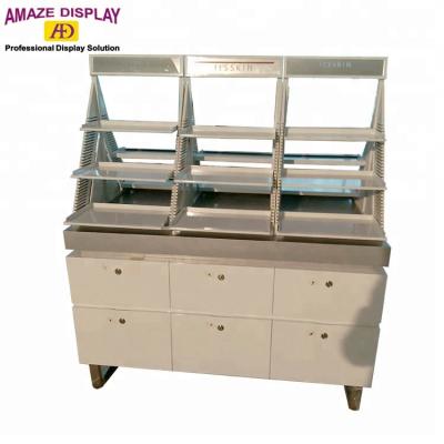 中国 With cabinet and double sided cosmetic trays makeup mac display stand 販売のため