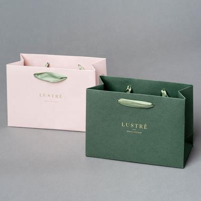 China Custom Luxury Recyclable Factory Ribbon Handle Boutique Shopping Packaging Custom Printing European Style Portable Gift Paper Bag With Logo for sale