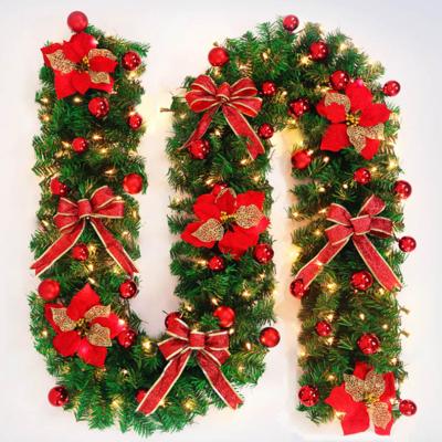 China Beautiful Decorated Christmas Flower Bowknot Led Pre Lit Artificial Christmas Wreath for sale