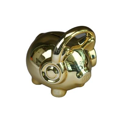 China Eco-friendly Wholesale Custom Pig Shaped Ceramic Piggy Bank Gold Animal Coin Piggy Bank for sale