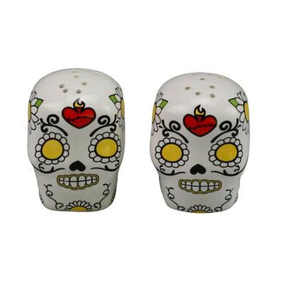 China Sustainable Halloween Decor Custom Printed Skull Shaped Ceramic Salt And Pepper Shaker for sale