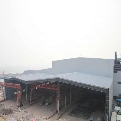 China Industrial Low Cost Prefabricated Factory Building Steel Structure Workshop With Steel Sheet for sale