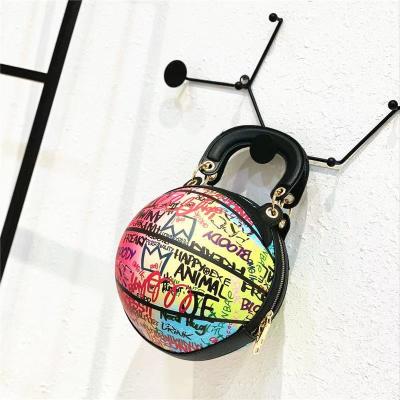 China 2021 hot hip hop style round shaped handbag colorful basketball purse graffiti luxury bags for sale