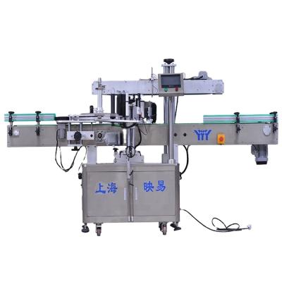 China Food adhesive sticker labeling machine with round bottle for tunnel for sale