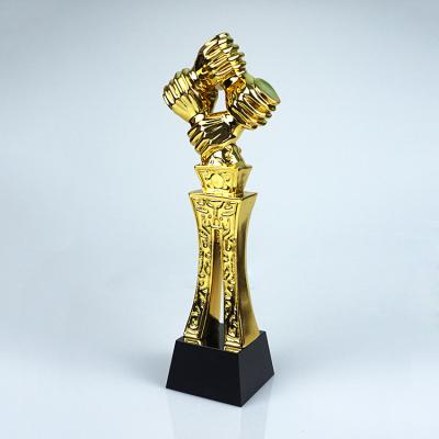 China handshake cooperation teamwork resin trophy award Te koop