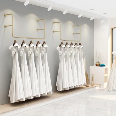 China Wall Mounted Retail Store Gold Wedding Dress Display Rack For Bridal Shop for sale