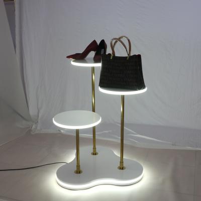 China Luxury Window Decoration Store Display Merchandise Clothing Display Rack Props Display Stand Table With Led Light for sale