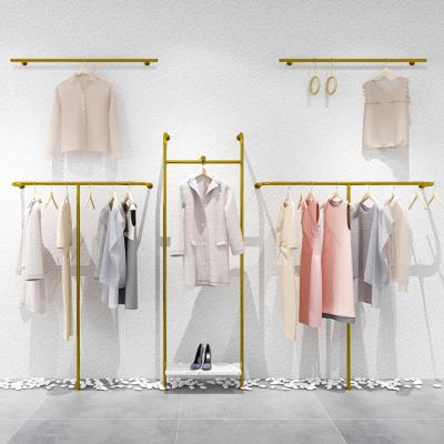 China Bridal Shop Gold Showroom Display Rack High End Wall Mounted Clothing Racks For Retail Store for sale