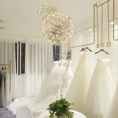 China Modern Bridal Clothing Store Hanger Wall Iron Rack Wedding Dress U Shaped Hanging Display Rack for sale