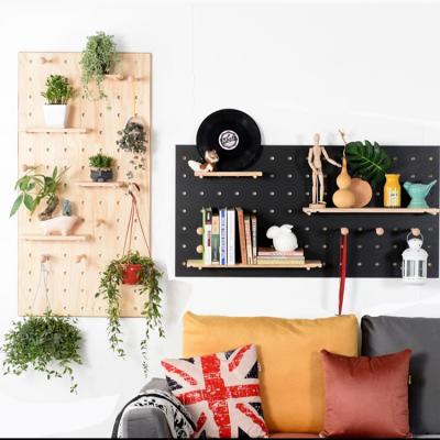 China Factory Wholesale High Quality Solid Wood Wall Mounted Hole Shelf Panel Storage Shelving Unit for sale