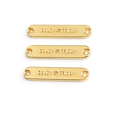 China Sustainable Metal Apparel Abaya Logo, Gold Swimwear Garment Tags For Clothes, Custom Eco Friendly Engraved Garment Apparel Metal Labels for sale