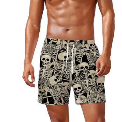 China 2022 New QUICK DRY Fashion Horror Skull Black Beach Swim Trunks Men's Beach Wear Pants Loose Swim Trunks for sale