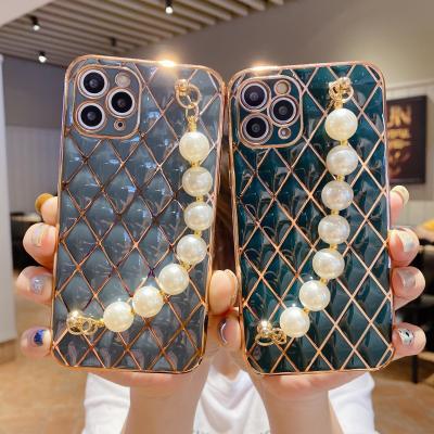 China 2021 Pearl Shockproof Luxury Wristband Soft Leather Cell Phone Case For iPhone 11 12 Pro for sale