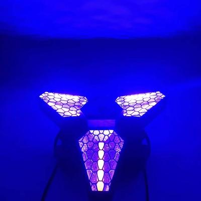 China Features 2022 Qixin Maple Leaf Shape Pixel Vintage Halogen Infinitely Rotating Stage Retro Background Led Strobe Triangle Retro Light for sale