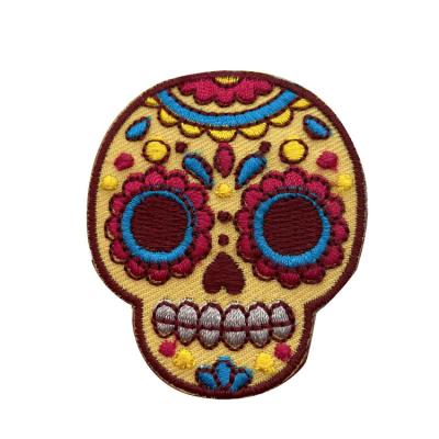 China Sustainable Custom Colored Crossbones Skull Shape Polyester Thread Embroidered Patches for sale