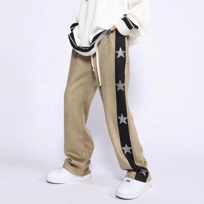 China Anti-Static Mens Loose Pants Men Branded Logo Customized Rhinestone Trousers for sale