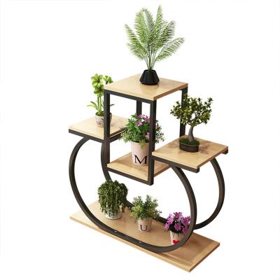 China Wholesale Modern Garden 4 Tiers Standing Black Iron Flower Stand Metal Flower Stand For Plant for sale