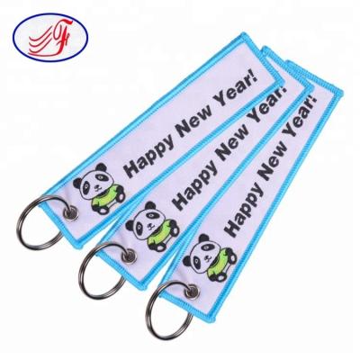 China Safe Wholesale Custom Brand LOGO Keychain Embroidery Tag Key Chains for sale