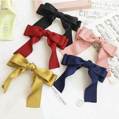 China New Product Fashion Hair Clip Solid Color Cloth Ribbon Bow Girl Hair Accessories Ponytail Spring Clip for sale