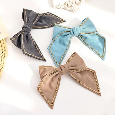 China Beautiful New Fashion Clip Hair Style Solid Color Cloth Big Bow With Chain Spring Clip Ladies Hair Accessories for sale