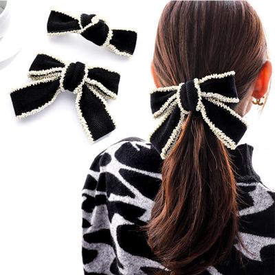 China Fashionable Female Ponytail Clip Female Clip Knot Strap Pearl Temperament Spring Clip Butterfly Female Hair Clip for sale