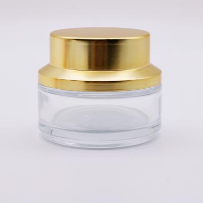 China Suppliers Custom Color Face Cream Cosmetic Jar Eco-friendly Design Container Gold Lid Glass Bottle And Glass Eye for sale