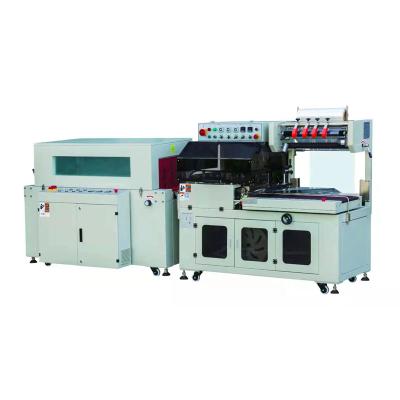 中国 Hot sale heat shrink wrapping machine for cosmetic sample fast food instant noodles fruits packing machine 販売のため