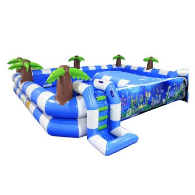 China 0.9mm PVC Tarpaulin Inflatable Coconut Tree Pool With Slides Tropical Ocean Theme Inflatable Pool for sale