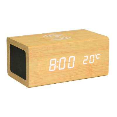 China New Arrival Mobile Phone Alarm Clock Wooden Radio Speaker Wooden Clock Charging Board and Desk Charging Wireless Clock for sale