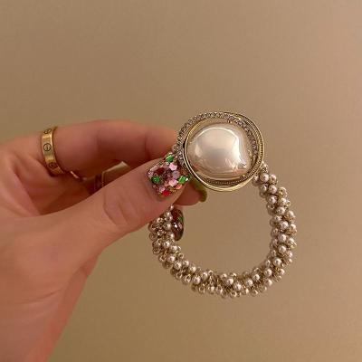 China Luxury Crystal Korean Pearl Hair Band Elastic Women's New Style Ins Hair Ring Ponytail Hair Accessories for sale