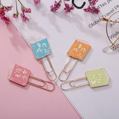 China Custom Book Shape Gift Metal Souvenir Zinc Alloy Paper Clip Learn Stationery Pointing Cartoon Metal Bookmark for sale