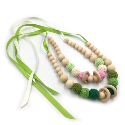 China Soft Toy Hot Sale Baby Shower Gift Wooden Teether Necklace Chew Hook Beads Wooden Teether Ring Necklaces for sale