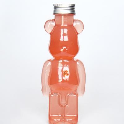 China Eco-friendly Juice 500ML 700ml Teddy Bear Shaped Plastic Clear Candy Gift Beverage Bottle With Lid Wholesale for sale