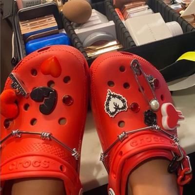 China SHOES CHARM 2022 New Popular Designer Soft PVC DIY Karol G Croc Charms Eva Clog Shoes Decoration Outfit for sale