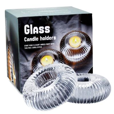 China Unique Wholesale Clear Glass Modern Art Round Tea Light Candle Holders for sale