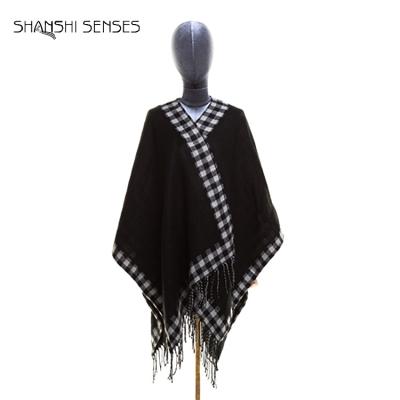 China Wholesale 100% Acrylic Girls Long Fancy Reversible Black Lady Poncho Wearable Shawl With Tassels for sale