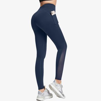 China Mesh Side Pocket Breathable High Waist Stretch Fitness Yoga Pants Plus Size Peach Hip Raise Hot Pants for sale