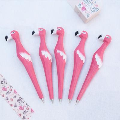 China Cartoon Ballpen Flamingo Bird Shaped Wood Carving Ball Pen Carved Wooden Pen Available For Gift Craft for sale