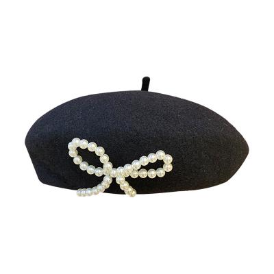 China COMMON Fashion Winter Women Girl Warm Knit Thicken Wool Knitted Beanie Berets With Rhinestone Pearl Bowknot Wool Beret Hat for sale