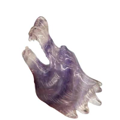 China Donghai Natural Purple Fluorite Hand Carved Wolf Head Healing Animal Crystal Crafts For Decoration for sale