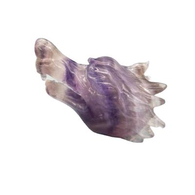 China Donghai Natural Purple Fluorite Hand Carved Wolf Head Healing Animal Crystal Crafts For Decoration for sale