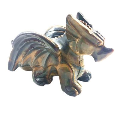 China Donghai Natural Quartz Crystal Flying Dragon Tiger Eye Dragon Hand-carved Gift for sale