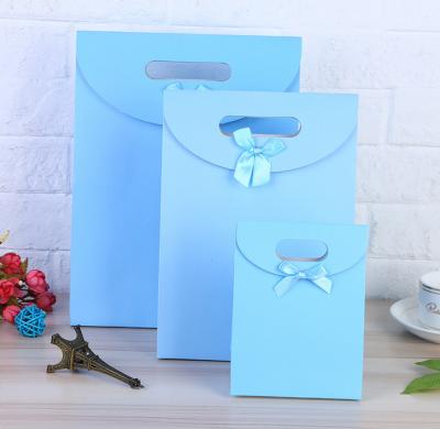 China Recyclable Paper Shopping Bag, Custom LOGO Printed Fancy Paper Gift Bag for sale