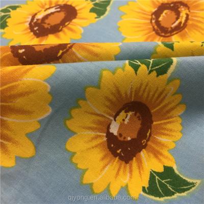 China Qiyong Textile Shrink-Resistant Sunflower Printing 100% Cotton Fabrics Textile Cotton Fabric Plain Weave Roll for sale